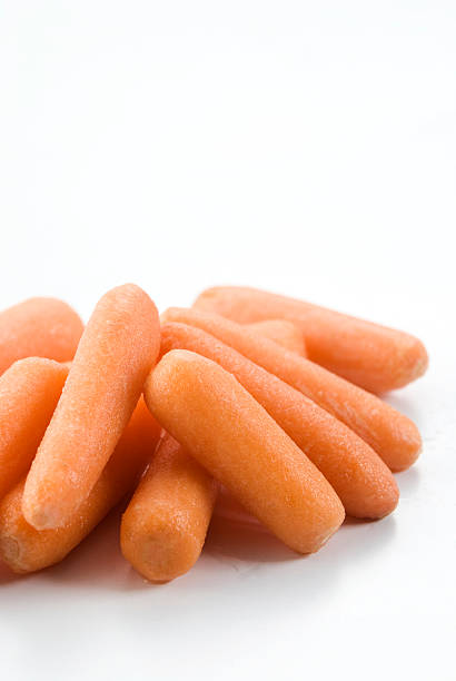 istock Fresh  Baby Carrots Isolated on a White Background 182903185