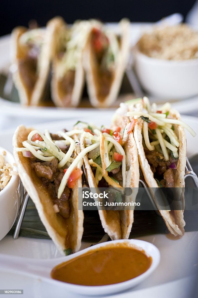 Korean Beef Tacos "Stir fried beef, fried vegetables in rice flat bread with spicy sauce" Korean Culture Stock Photo