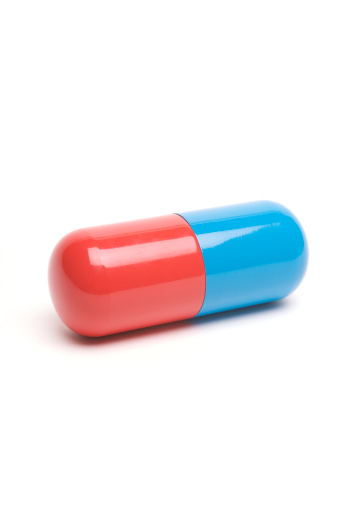 Vibrant Red And Blue Capsule Pill On White Photo - Download Image - Antibiotic, Beauty, Blue - iStock