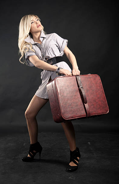istock Woman holding a suitcase 182903629