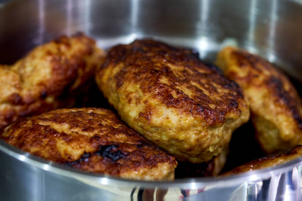 cutlets lie in a pan in the kitchen