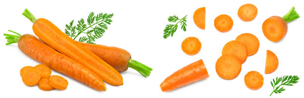 istock sliced carrot with green leaves isolated on white background. clipping path 1829039673
