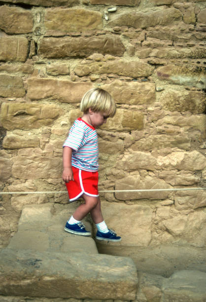 istock Mesa Verde NP - Step House - Small Boy on Trail  - 1990 1829041243