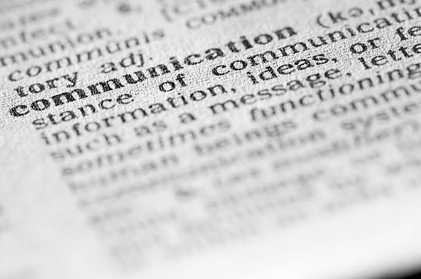 istock Dictionary definition of communication in black type 182904236