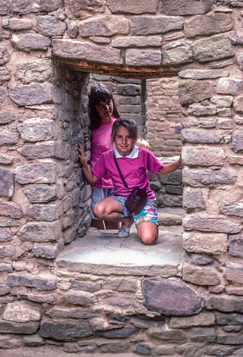 Aztec Ruins NM - Girls in Doorway - 1990. Scanned from Kodachrome 64 slide.