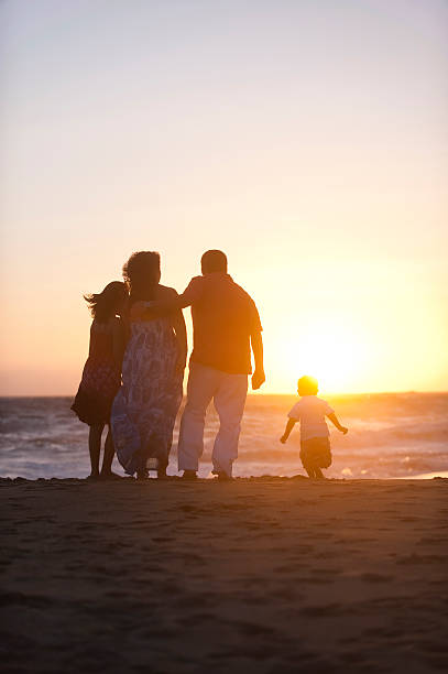 istock Family enjoying the sunset 182904540