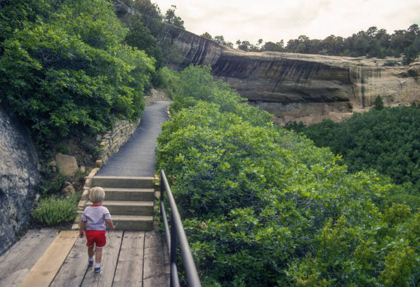Mesa Verde NP - Step House - Small Boy on Trail  - 1990. Scanned from Kodachrome 25 slide.