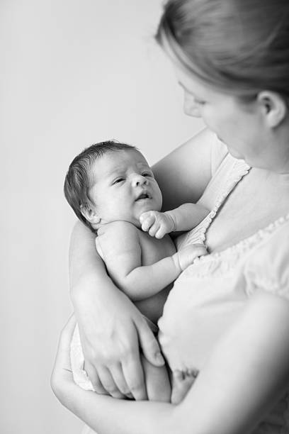 istock Loving Mother Holding Her Newborn Baby 182905556