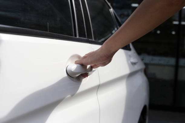 istock Male hand opening car door 1829056687
