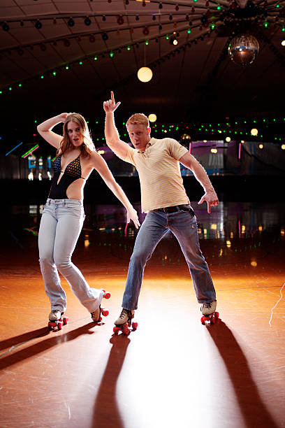 istock Young couple roller skating disco fever 80s style 182905743