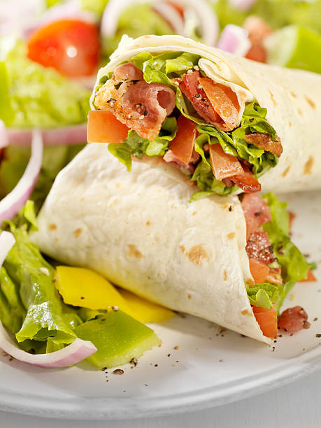 istock BLT Wrap Sandwich with a Salad 182905867