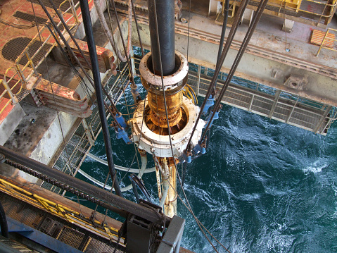 The riser and slip joint of a semisubmersible oil rig which carries oil and gas to the surface while drillingMore oil rig images at: