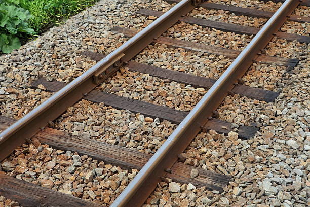 railroad track - leaving nobody one way photography stock-fotos und bilder