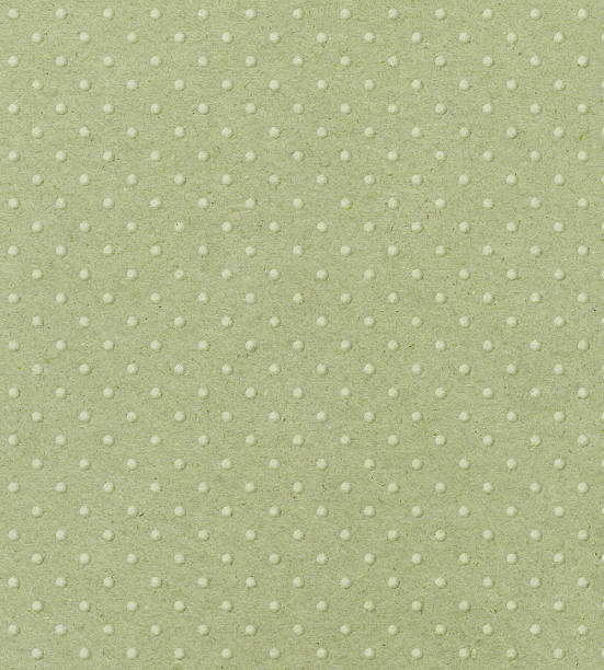istock pale green paper with raised dots 182906960
