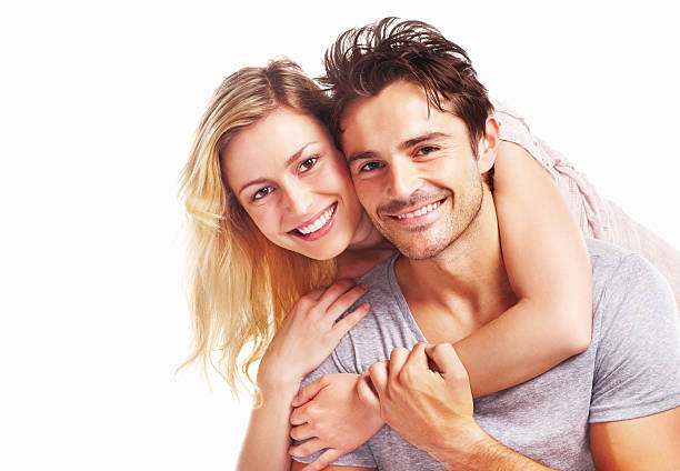 istock Young beautiful woman embracing a man isolated on white 182907095
