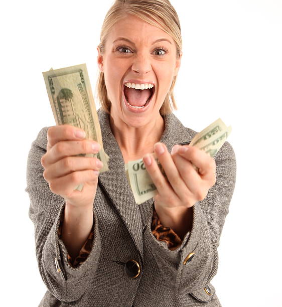 istock excited woman with money 182907265