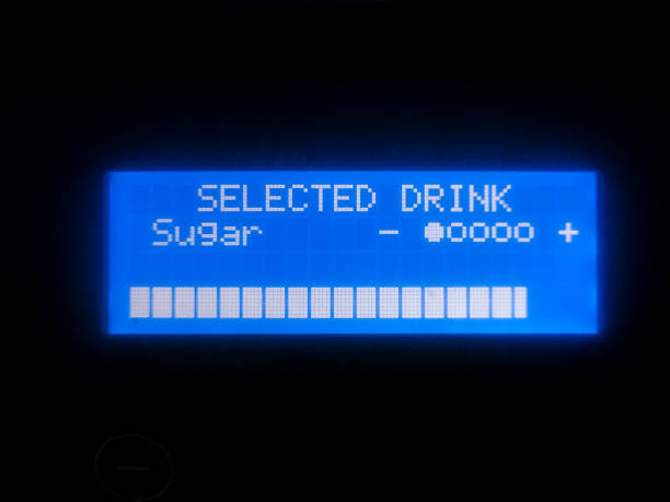 istock Selected drink inscription on the blue display of the coffee machine and the loading indicator, close-up. 1829073112
