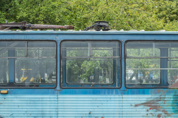 istock Window of old abandoned empty blue tram. 1829074812