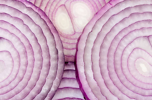 Closeup of cut up red onions in circles stock photo