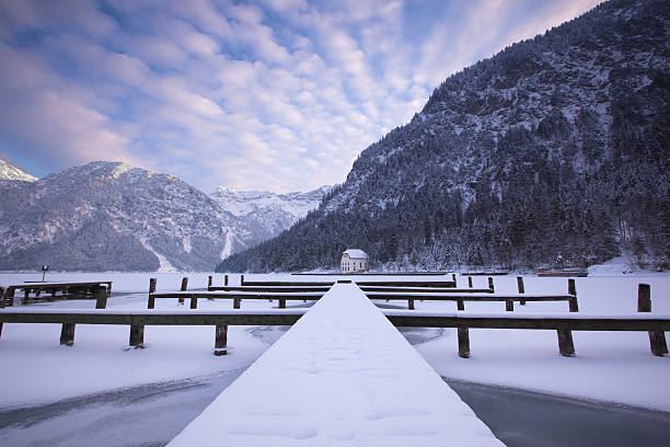 istock lake plansee in winter- tirol -austria 182907789