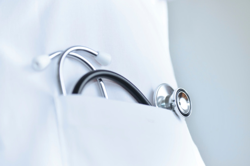 Macro of Stethoscope In doctors lab coat pocket.