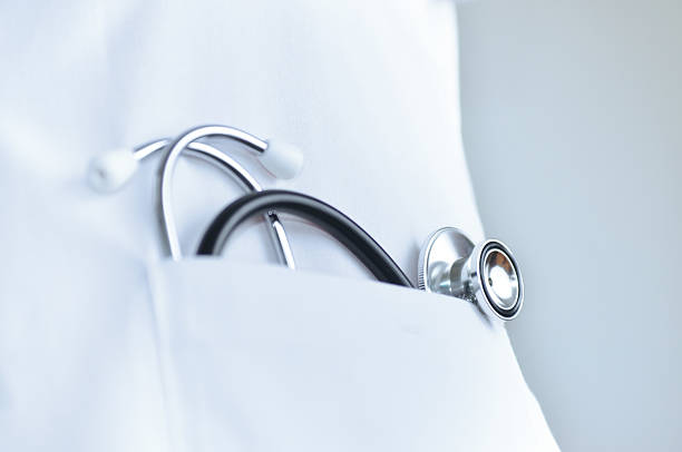 Stethoscope In doctor's lab coat pocket stock photo