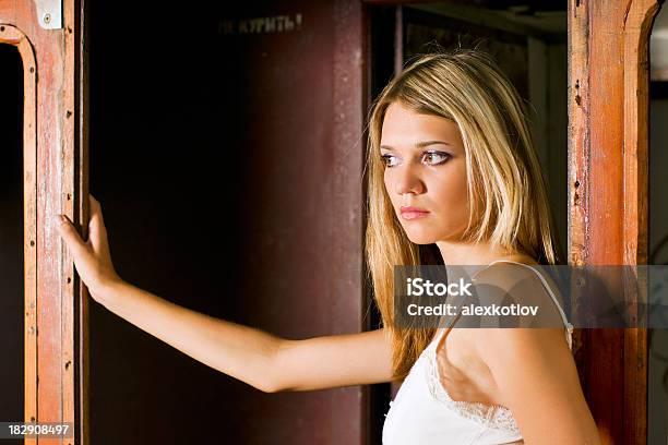 Young Woman Standing In Doorway Stock Photo - Download Image Now - Adult, Adults Only, Beautiful People