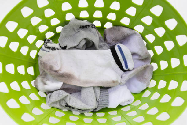 istock Dirty white socks in laundry basket 1829085785
