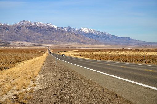 In the Great Basin of Nevada, highways and dirt roads stretch straight for miles into the horizon.