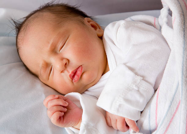 istock Newborn baby - peacefully sleeping 182909163