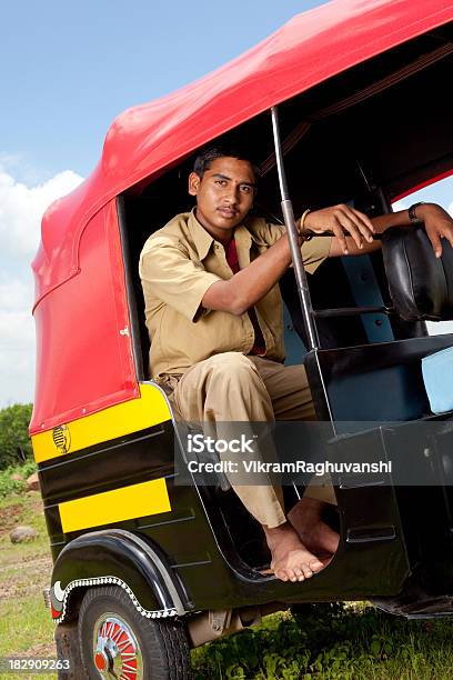 Pensive Indian Auto Rickshaw Driver Stock Photo - Download Image Now - 18-19 Years, Asia, Black Color