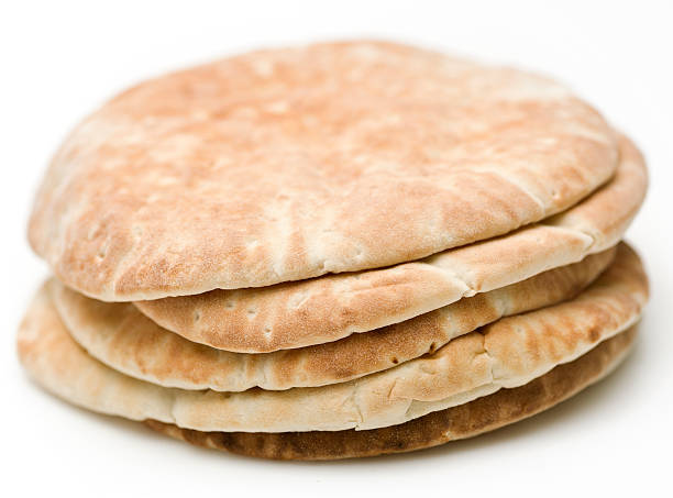 Pita Bread Pile of Pita Bread on White Background (this picture has been taken with a Hasselblad H3D II 31 megapixels camera) pita bread isolated stock pictures, royalty-free photos & images