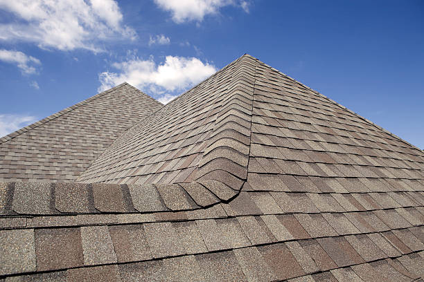 istock New Roof Cap Leads to Peak and Blue Sky 182910631