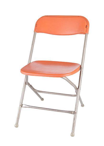Old Orange Folding Chair Old orange folding chair isolated on white. folding chair stock pictures, royalty-free photos & images
