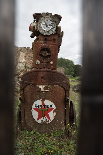 Oradour-sur-Glane, France – October 11, 2023: Detail of the remains of an old Texaco Girtex portable gasoline pump