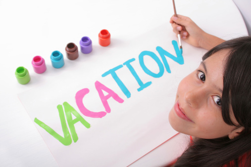 Young girl writing the word VACATION with temperas (Focus on the girl)Some other related images:
