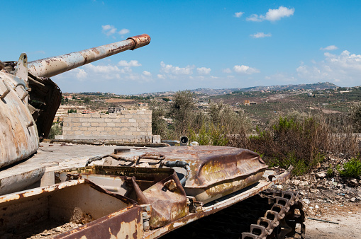 Sainte-Marie-du-Mont, France - Sept. 6, 2023: M4 Sherman medium tank and monument to the 4th Infantry Division of the US Army in front of the Utah Beach Landing Museum dedicated to D Day.