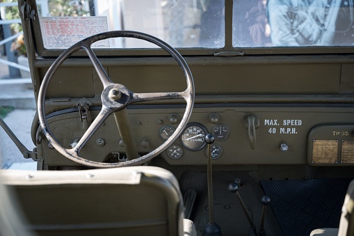 Normandy, France – October 13, 2023: Detail of a clasinterior view of an original WWII American Willys Jeep parked on the street