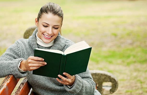 istock Woman Reading in the Park 182911504