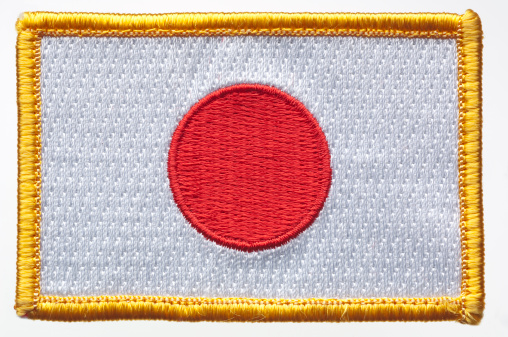 Japan's flag patch on white background.