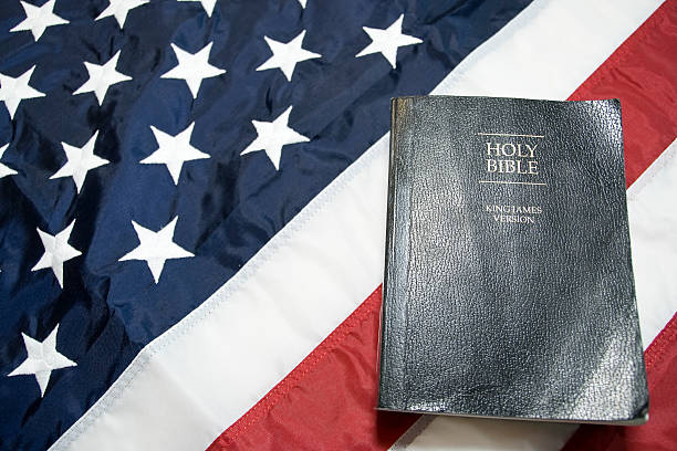 istock Holy Bible and American Flag 182913069
