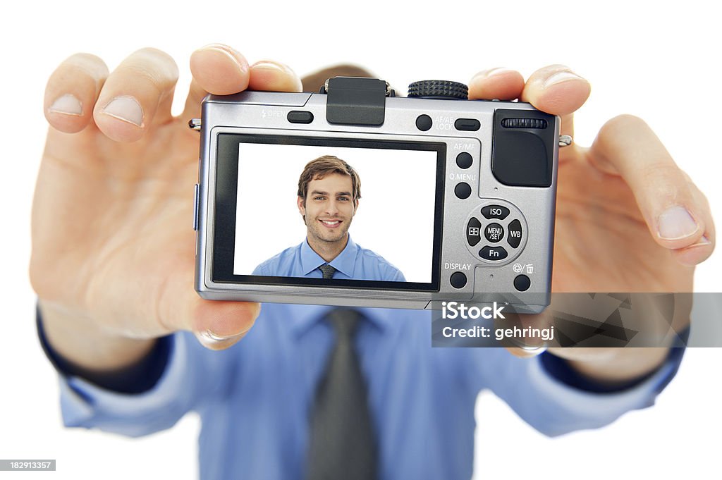 Portrait of a smiling young businessman "Portrait of a smiling young businessman, taking selfportrait, against isolated white background" 20-29 Years Stock Photo