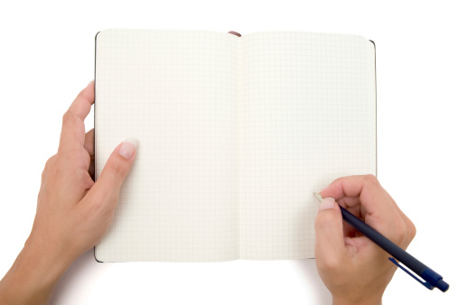 Female hands holding pen and notebook. Ready to write something down. White background.