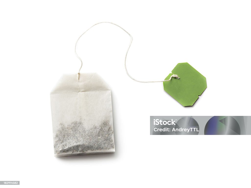 Teabag "Tea bag with green label isolated on white, It may be herbal, green or black tea" Teabag Stock Photo