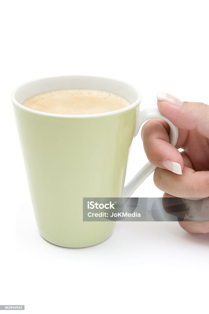 Holding a Cup of Coffee Having a cup of fresh coffee. White background. Adult Stock Photo