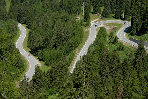 istock Swiss curving alpine road 182915245