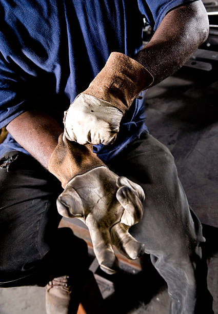 istock Cropped African American worker donning gloves 182915507