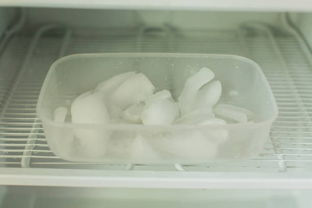 istock Ice in the refrigerator freezer. Defrosting 1829162666