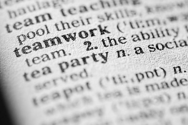 istock Dictionary definition of teamwork in black type 182916289
