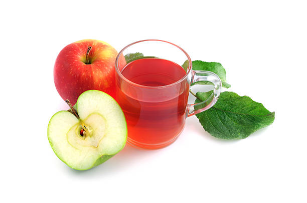 istock apple tea in glass with decorative leaf - Apfeltee 182916492